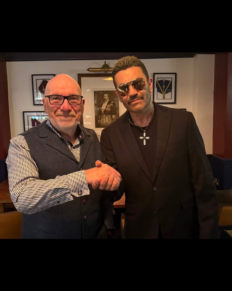Two members at a George Michael tribute night at the Masonic Hall